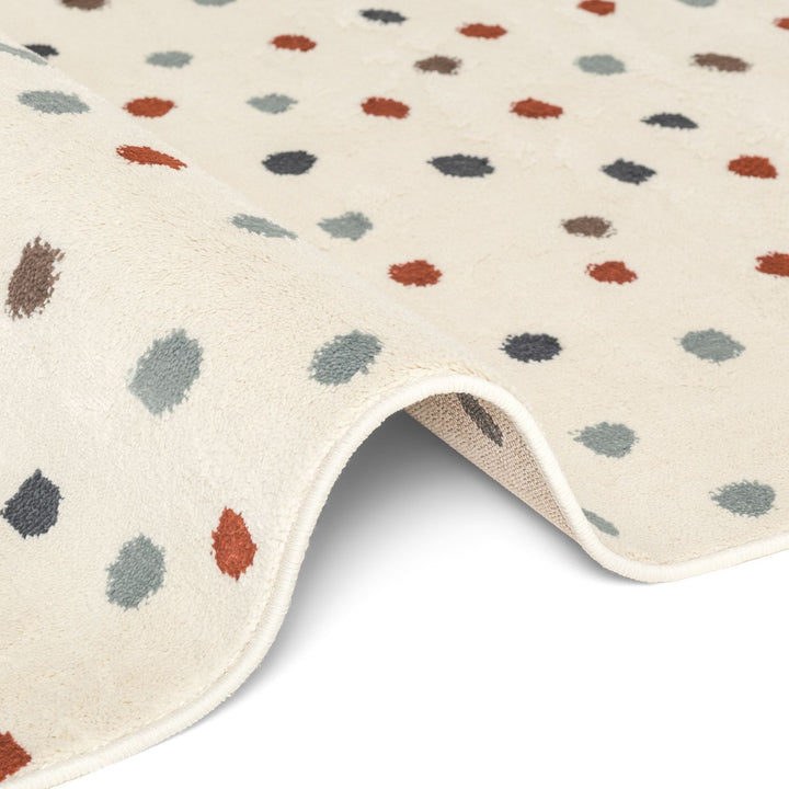 Beige rug with multicolored abstract pattern on a white background