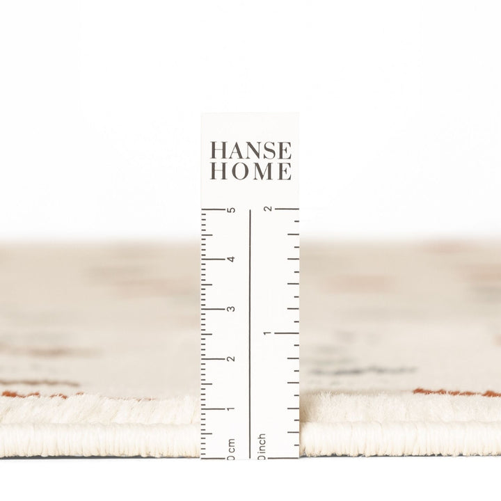 Textured fabric swatch with a ruler and 'HANSE HOME' branding.