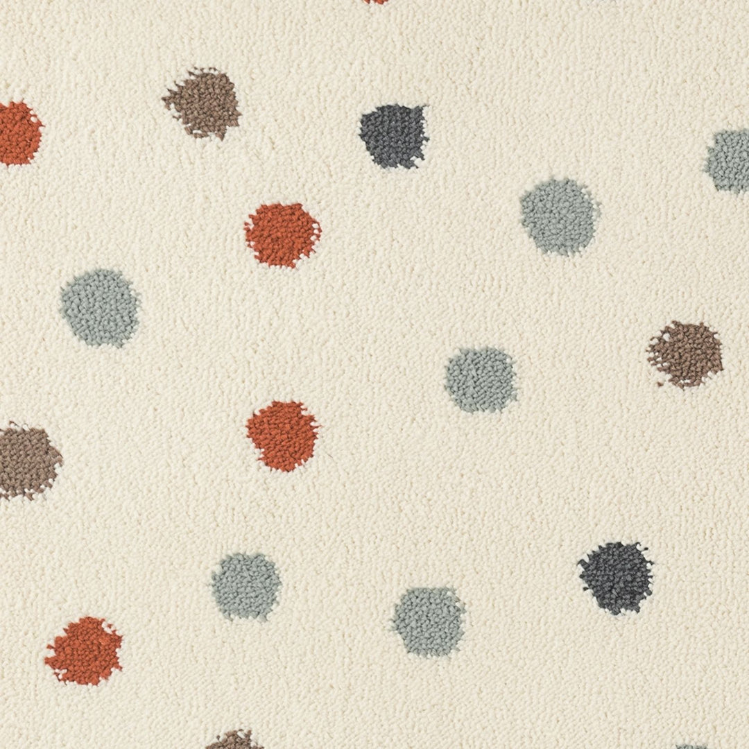 Patterned carpet with multicolored dots on a beige background