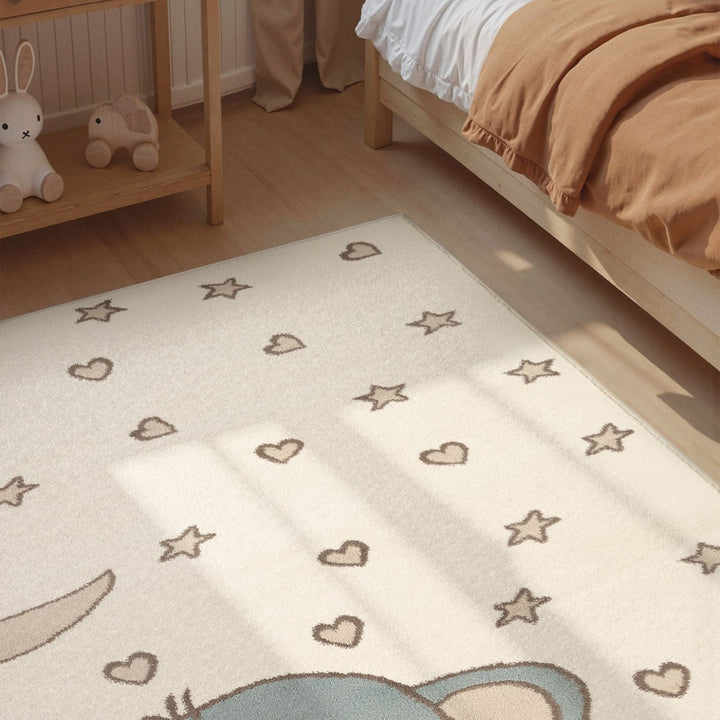 Children's room with a patterned rug featuring stars, hearts, and a cartoon character.