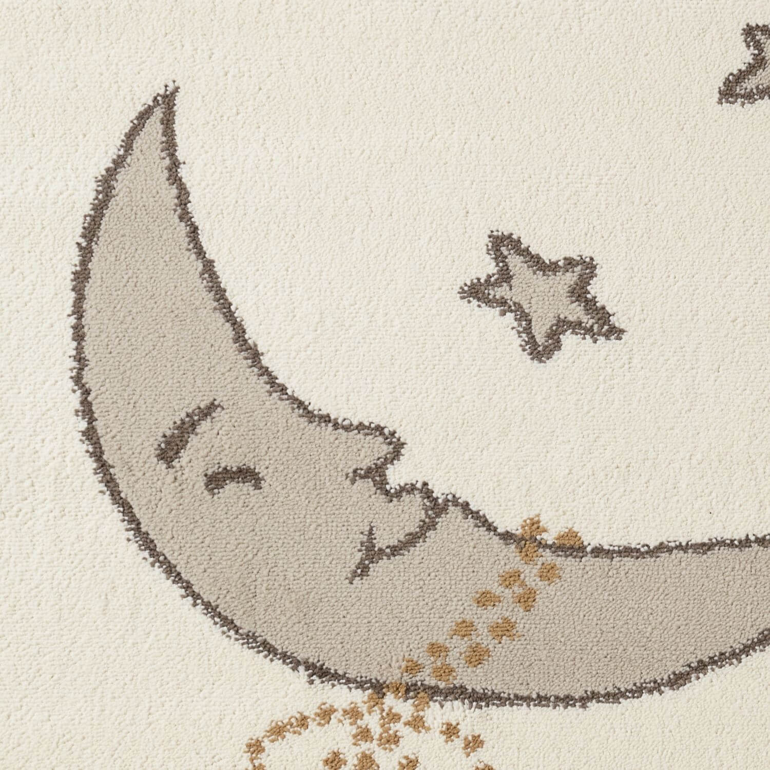 Decorative rug with a smiling moon and star design on a beige background