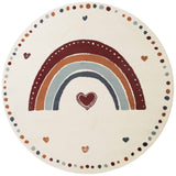 Round rug with a rainbow and heart design on a white background