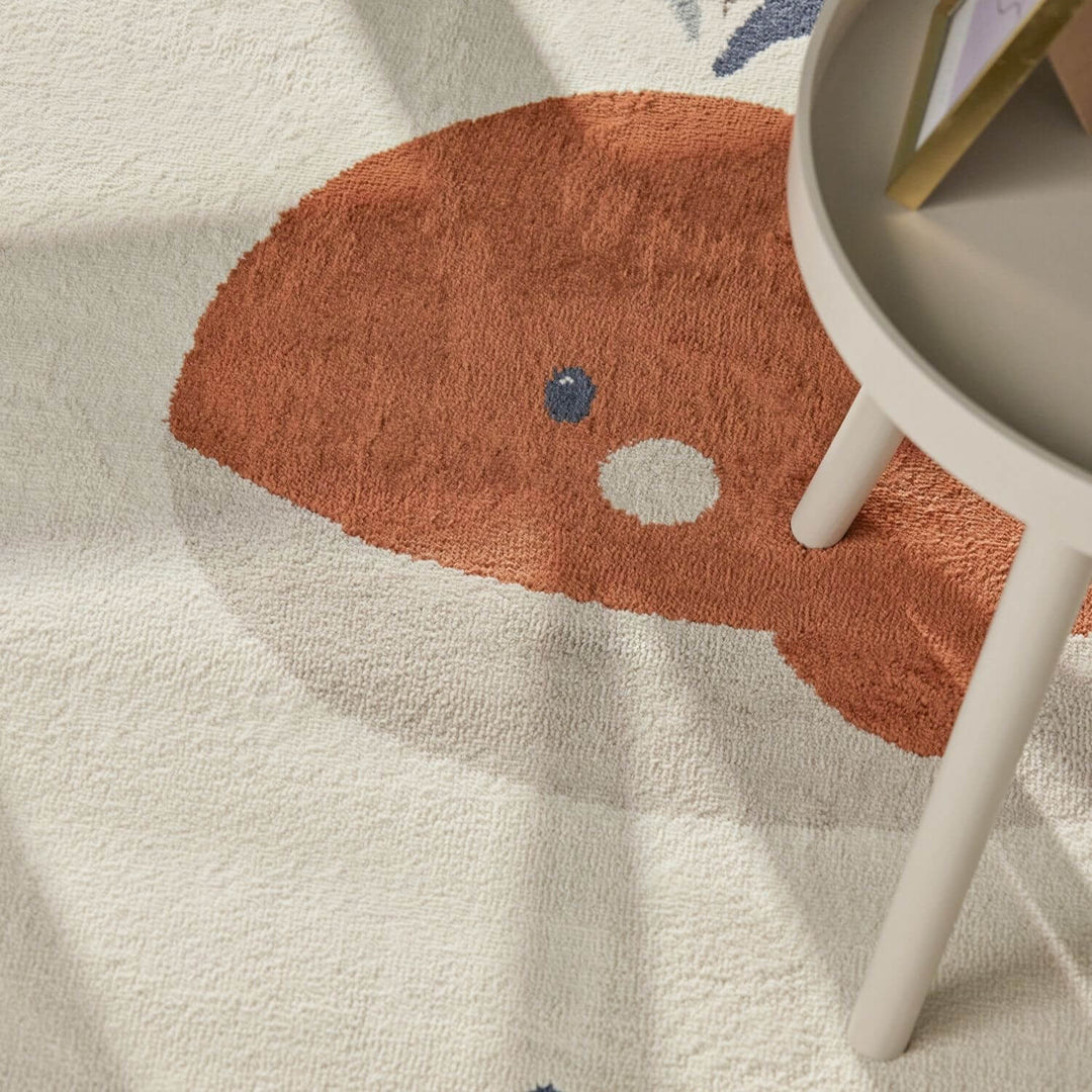 Children's rug with a fish design on a light background