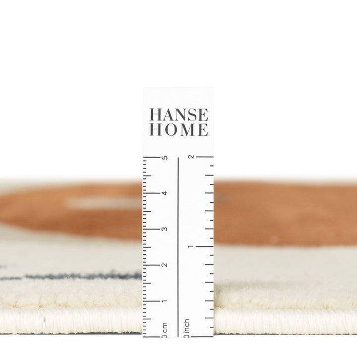 Textured fabric swatch with a ruler and 'HANSE HOME' branding on a white background