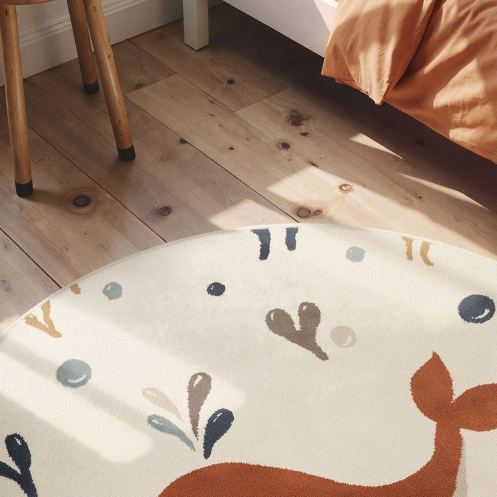 Children's rug with deer design on a wooden floor
