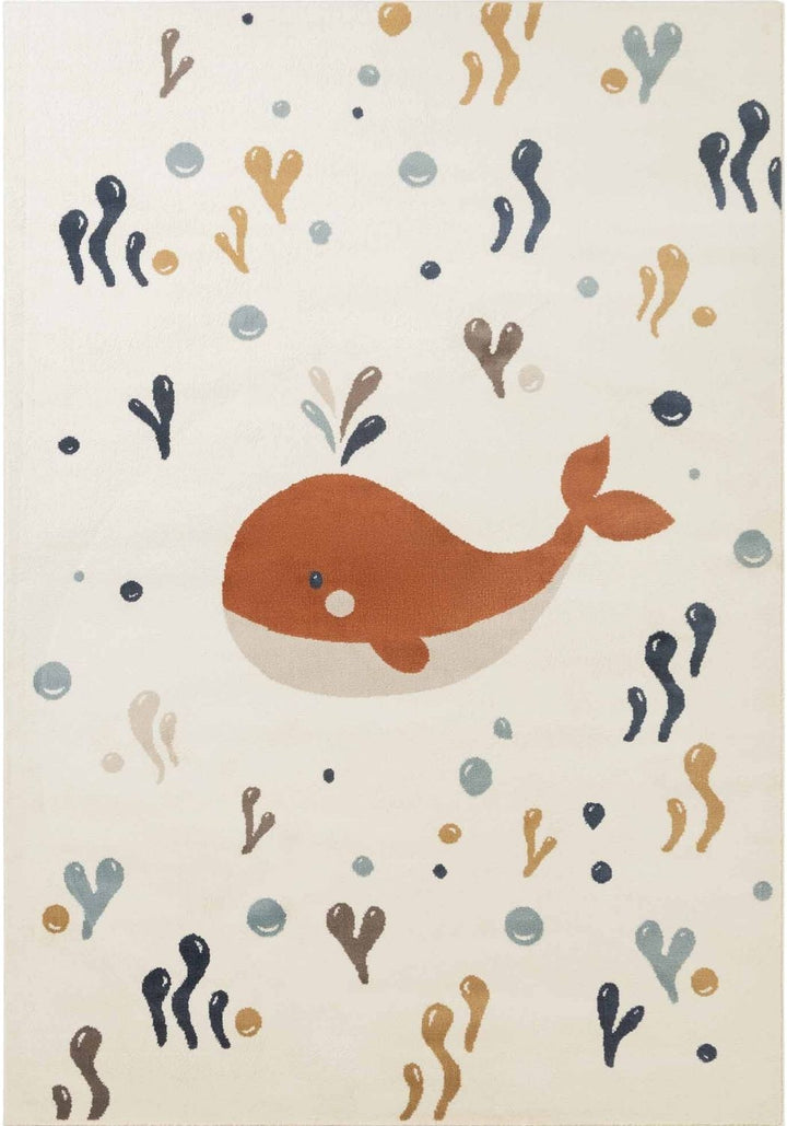 Children's rug with a whale design and underwater elements on a beige background