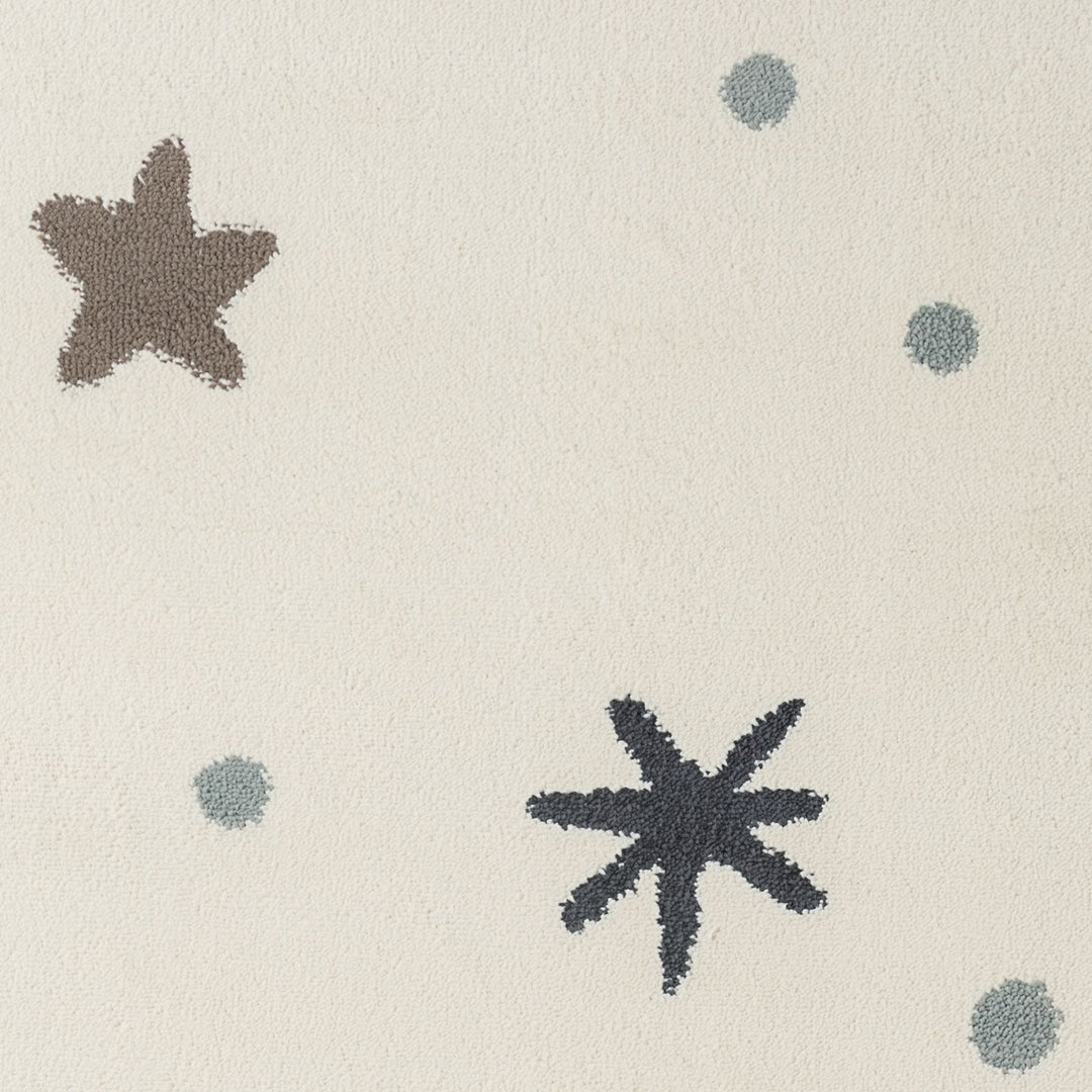 Textured fabric with star patterns in black and gray on a beige background
