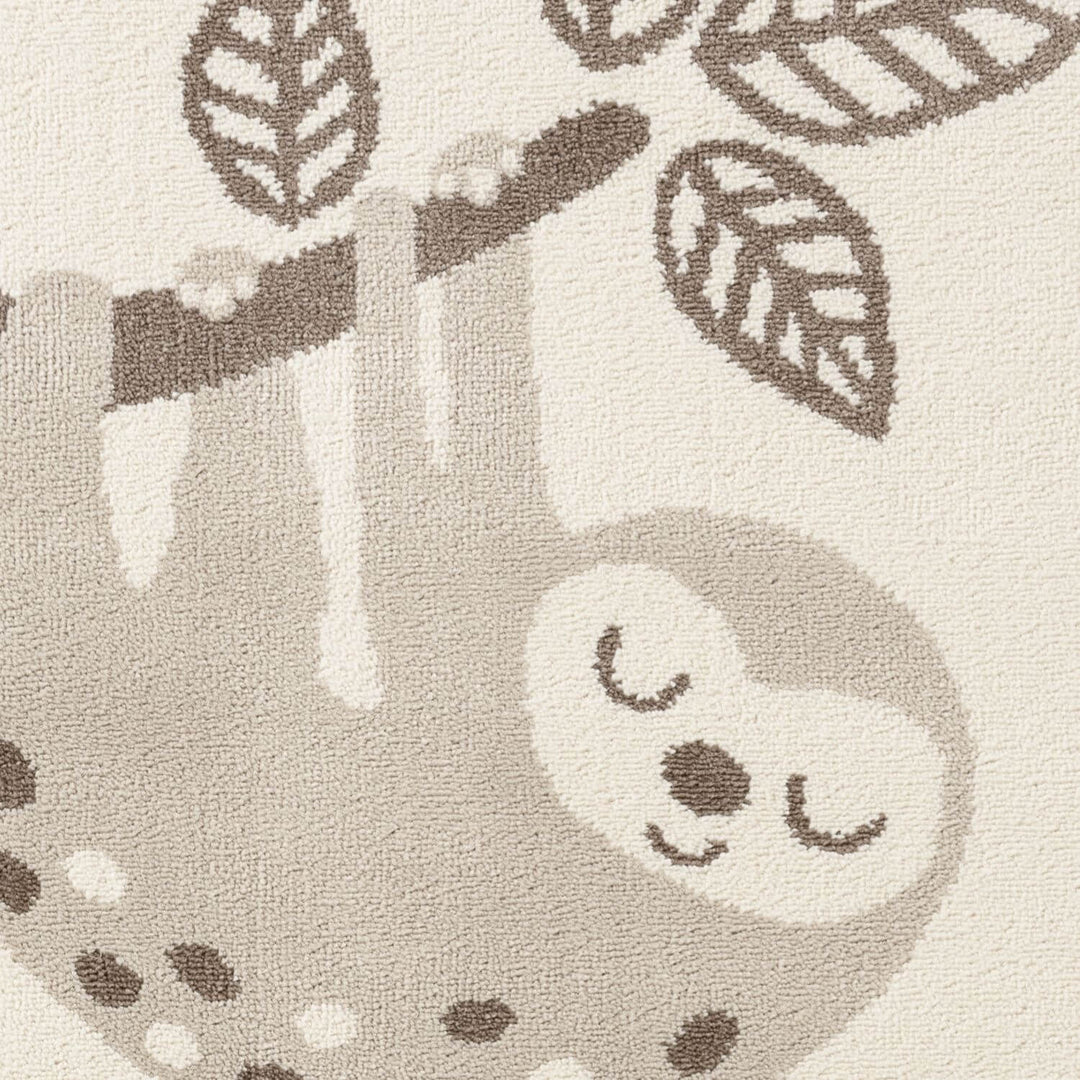 Textured fabric with a sloth design on a neutral background
