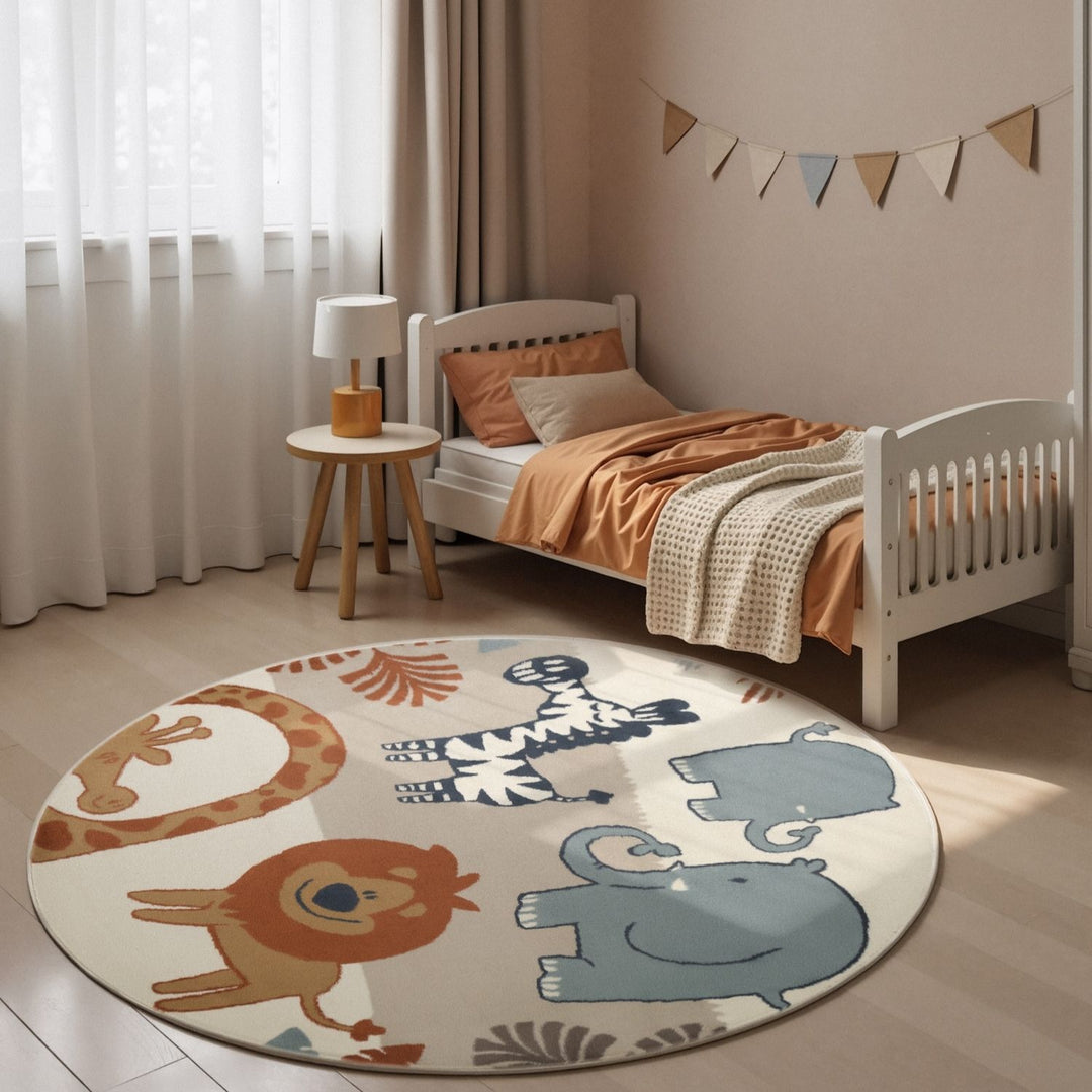 Children's room with a round rug featuring animal illustrations, a bed, and a small table.