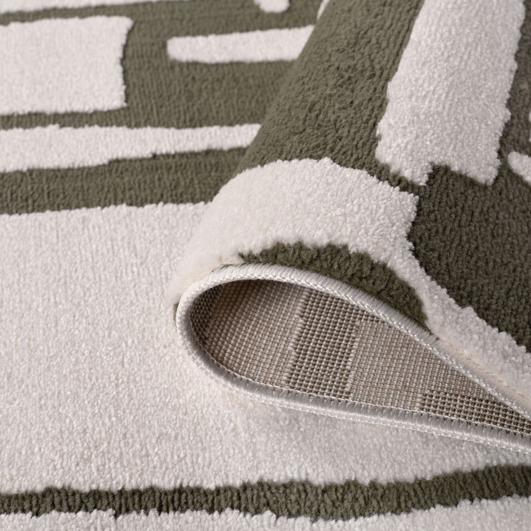 Close-up of a textured rug with geometric pattern