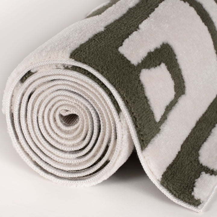 Rolled-up yoga mat with a pattern on a light background