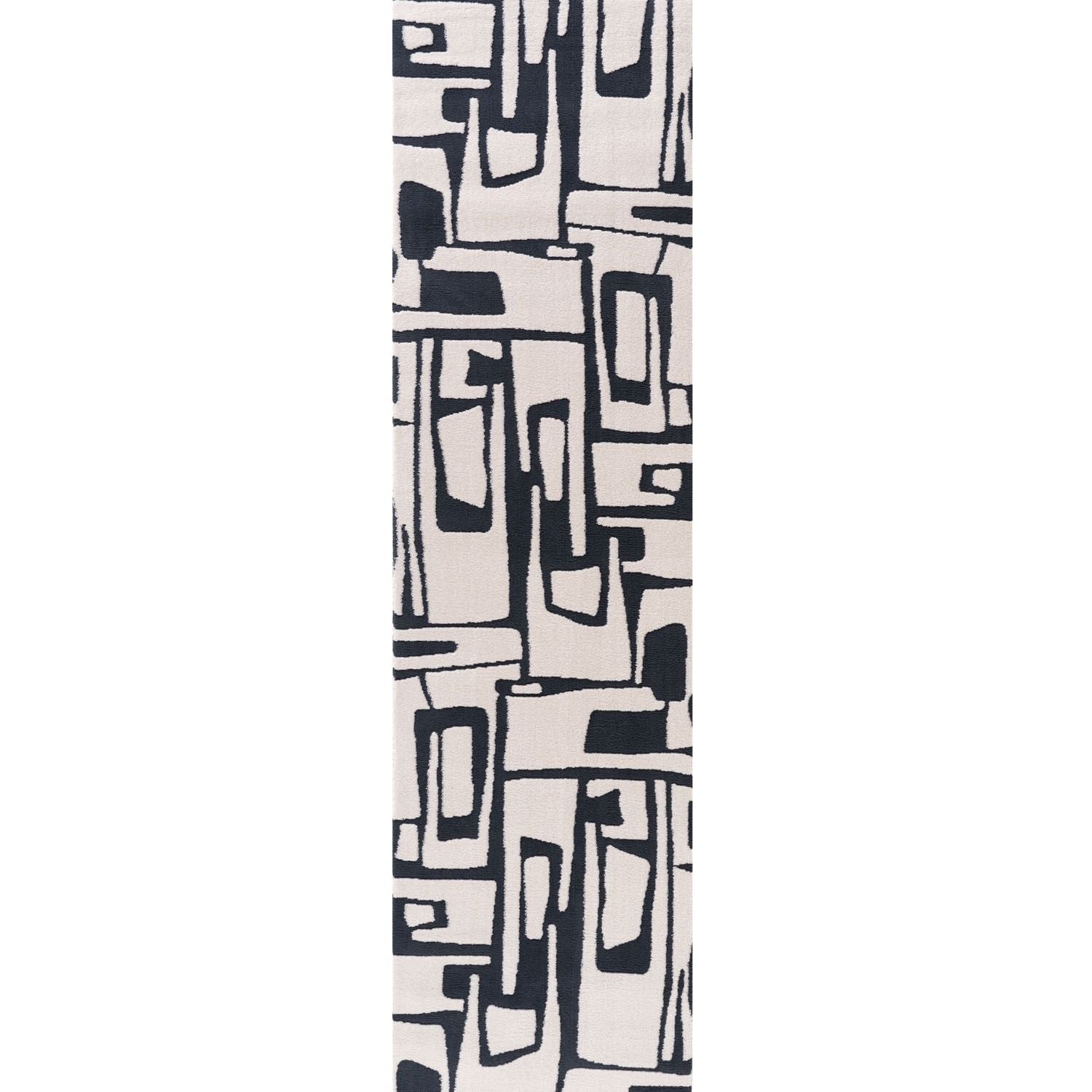 Black and white abstract patterned rug on a white background