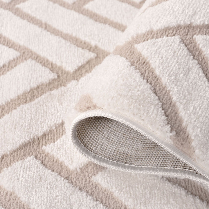 Close-up of a textured rug with geometric pattern