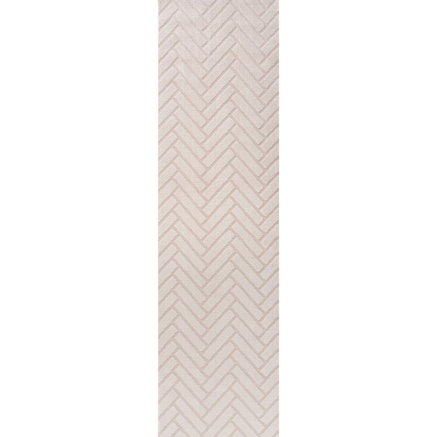 Rectangular area rug with a beige and white chevron pattern on a plain background
