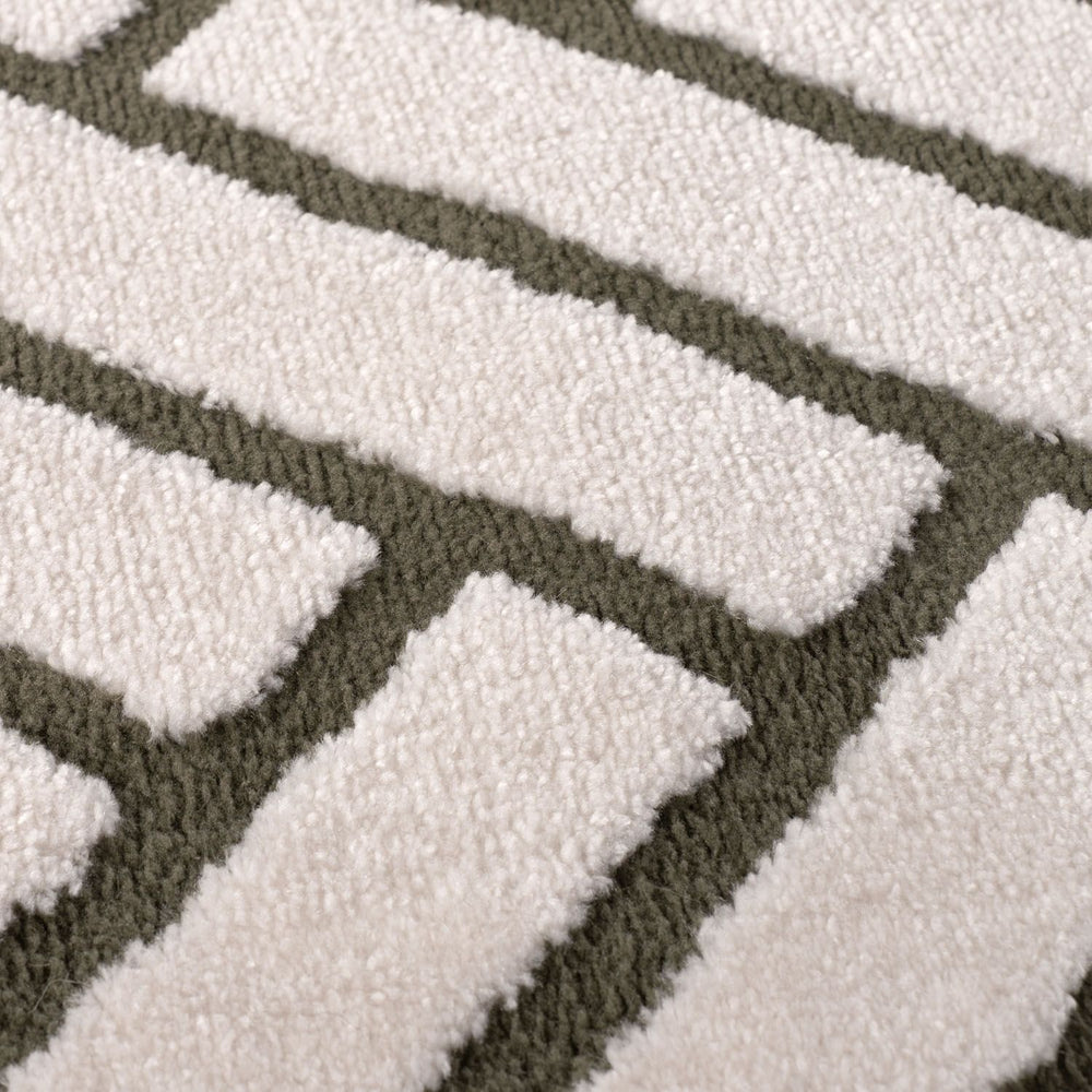 Close-up of a textured rug with geometric pattern