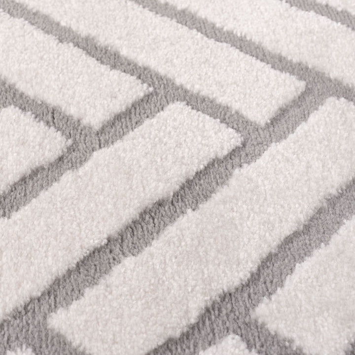 Close-up of a textured gray and white patterned rug