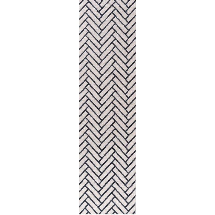 Black and white chevron patterned rug on a white background