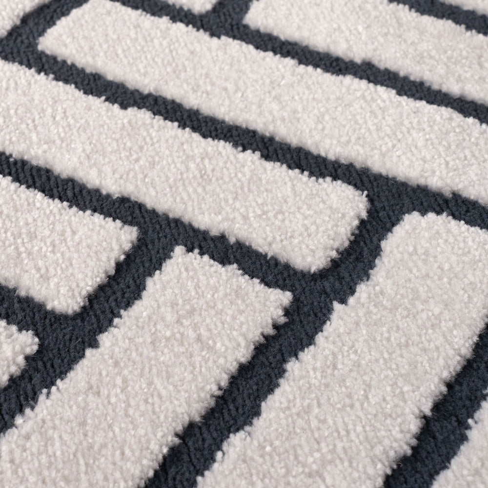 Close-up of a textured rug with geometric pattern