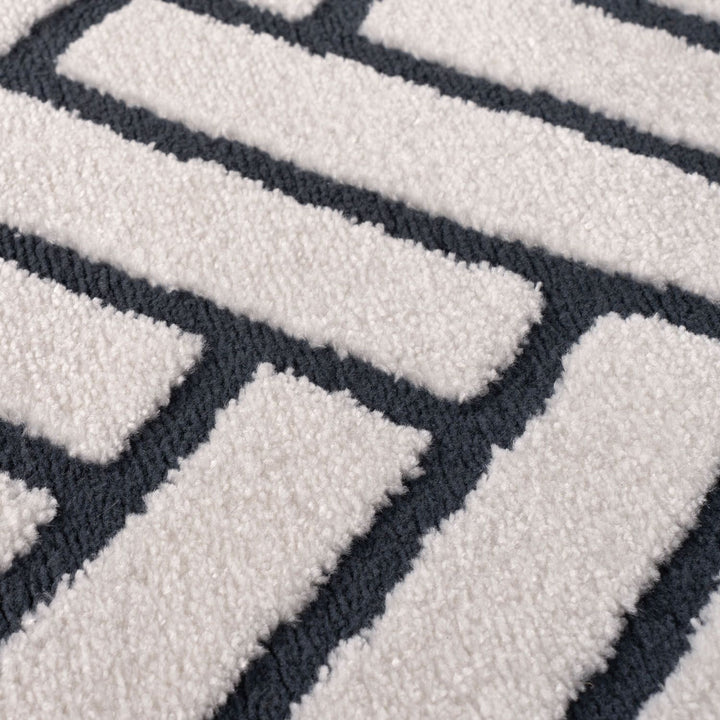 Close-up of a textured rug with geometric pattern