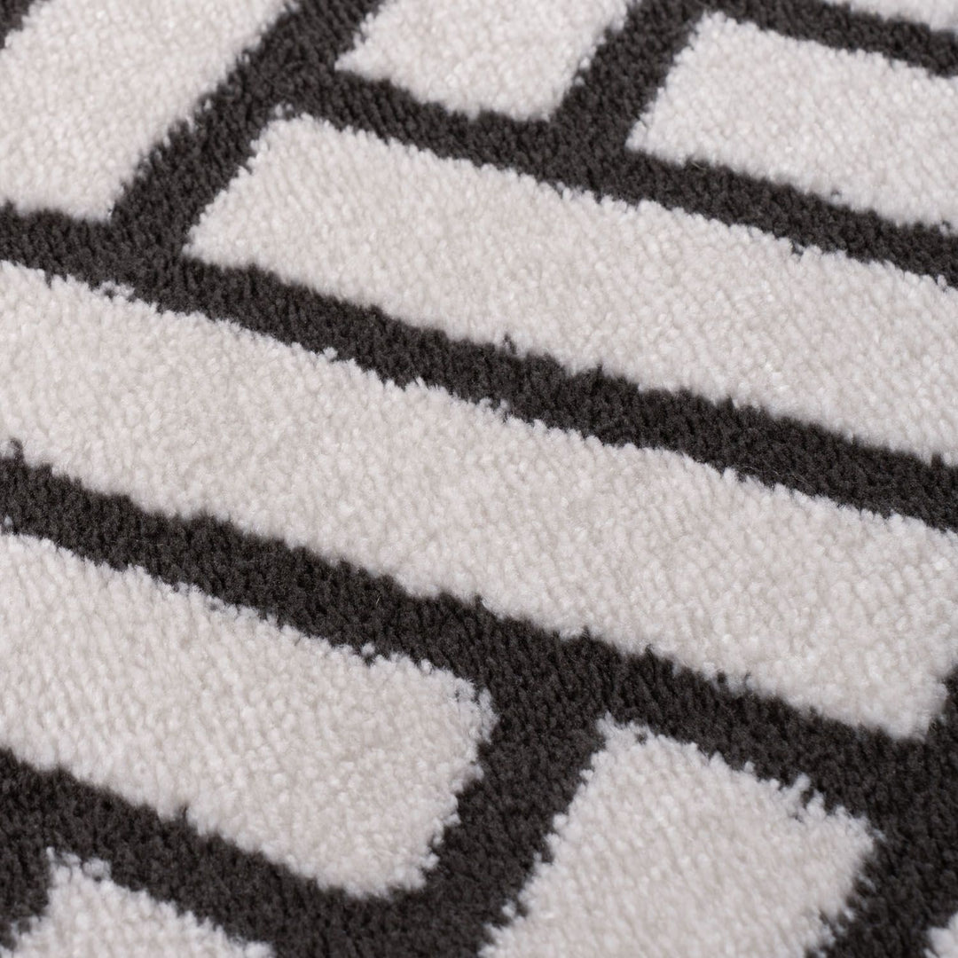 Close-up of a textured surface with black and white geometric pattern