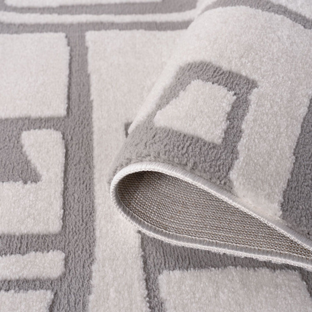 Gray textured rug with geometric pattern