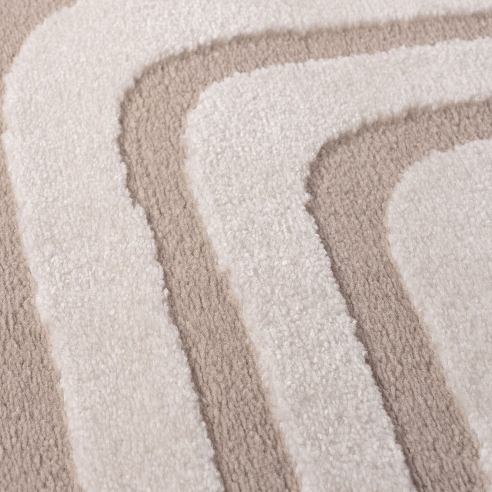 Close-up of beige and white textured rug swatches