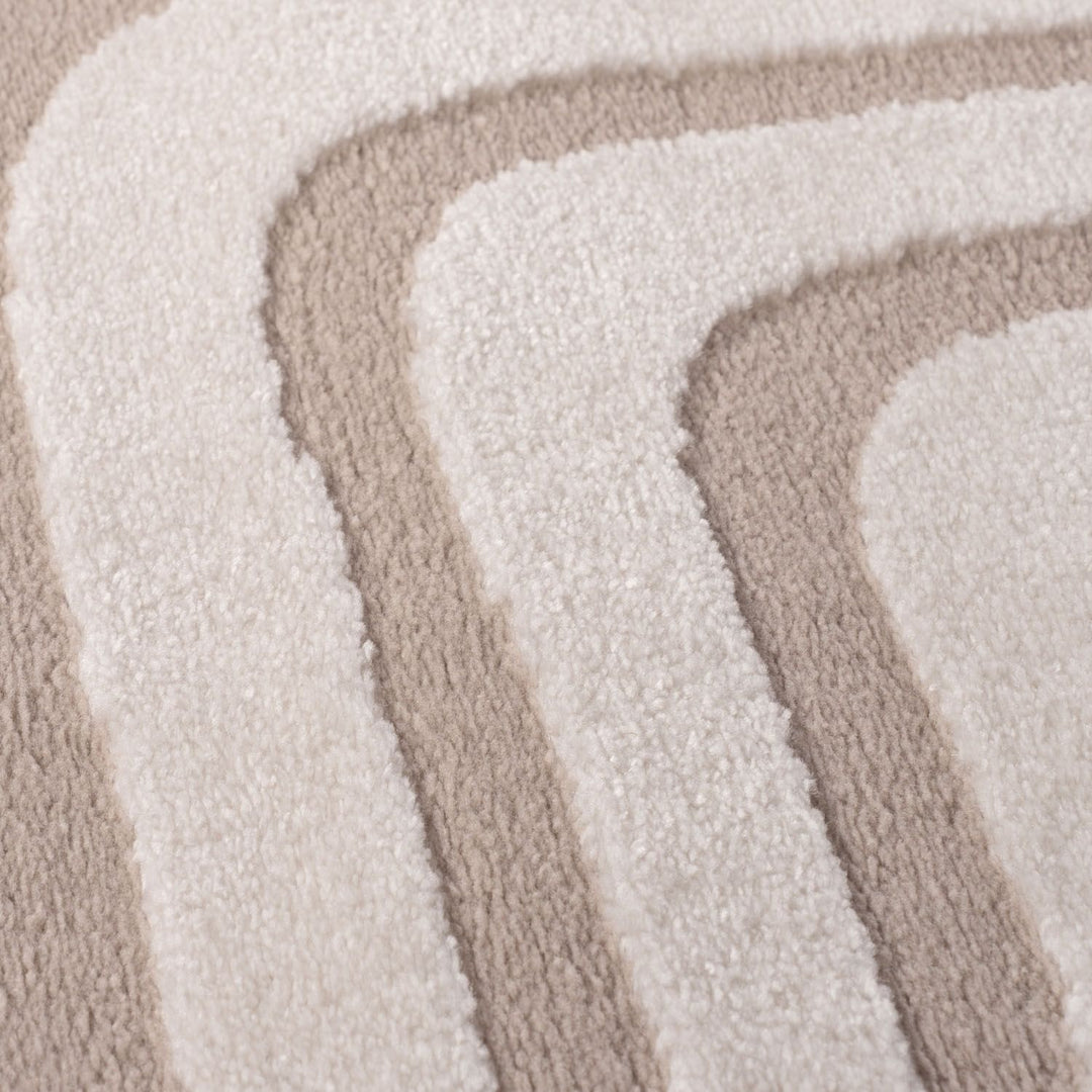 Close-up of beige and white textured rug swatches
