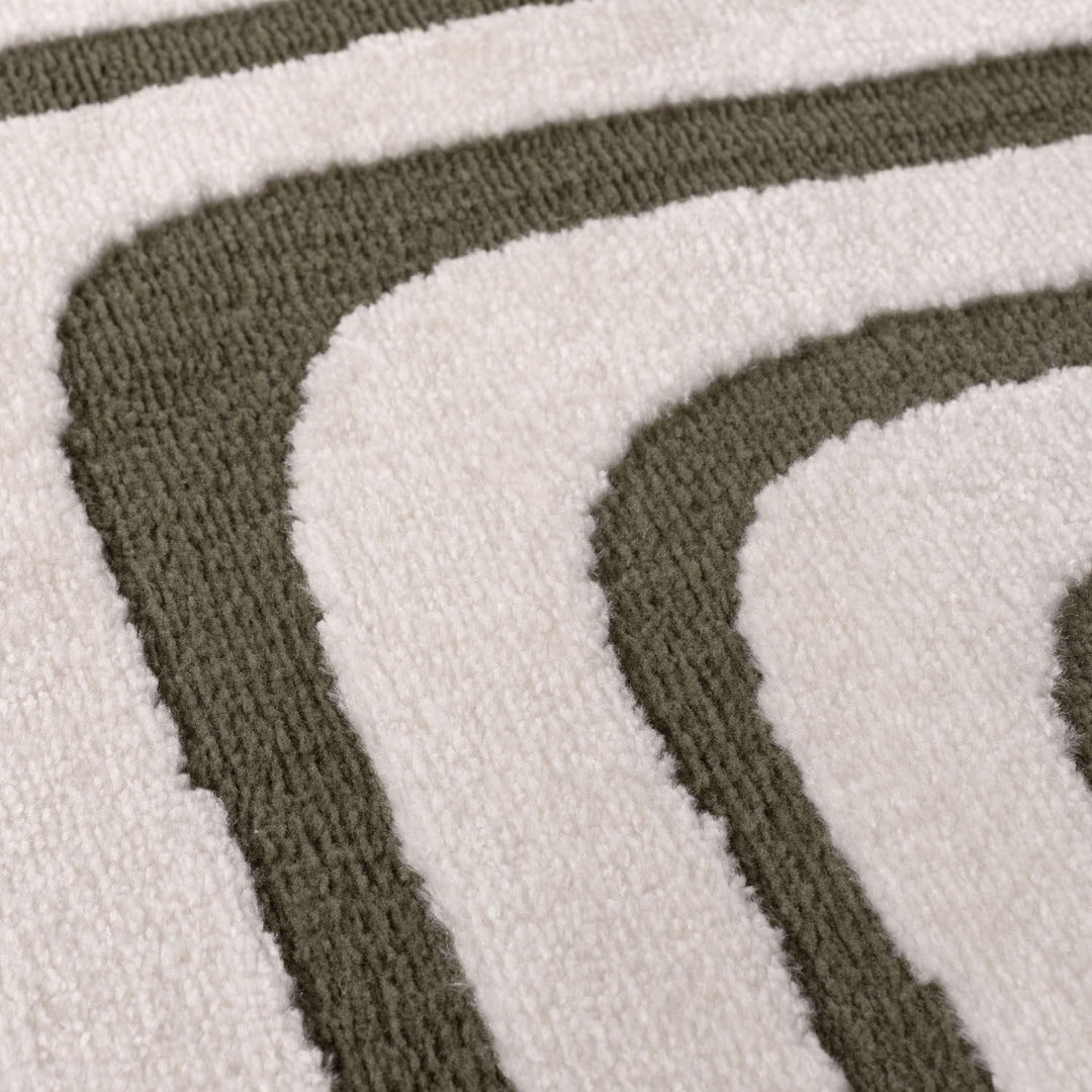 Close-up of a textured rug with brown and white stripes