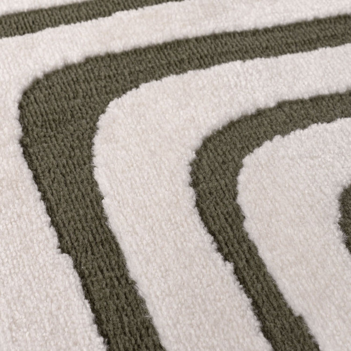 Close-up of a textured rug with brown and white stripes