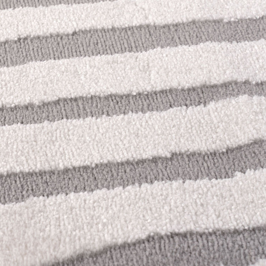 Close-up of a textured fabric with horizontal gray and white stripes.