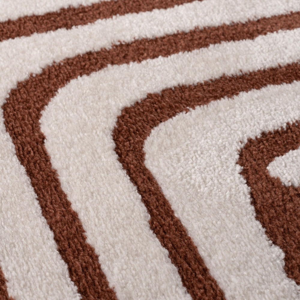 Close-up of a brown and white striped patterned rug.