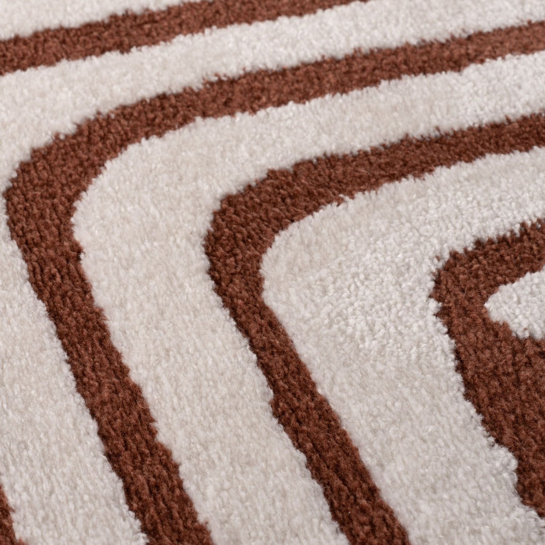 Close-up of a brown and white striped patterned rug.