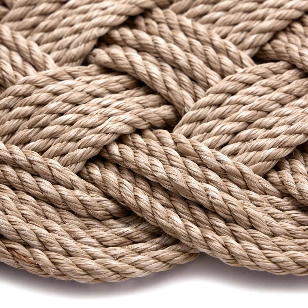 Close-up of beige rope on a white background