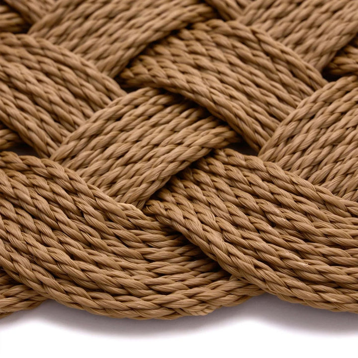 Close-up of braided brown rope on a white background