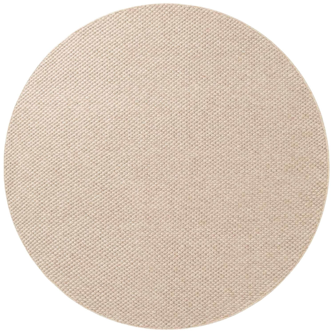 Round beige rug on a white background