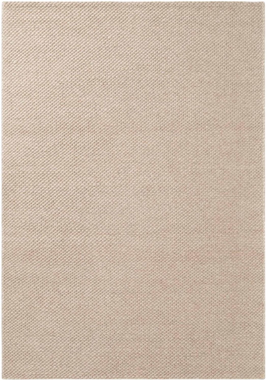 Beige area rug with a subtle pattern