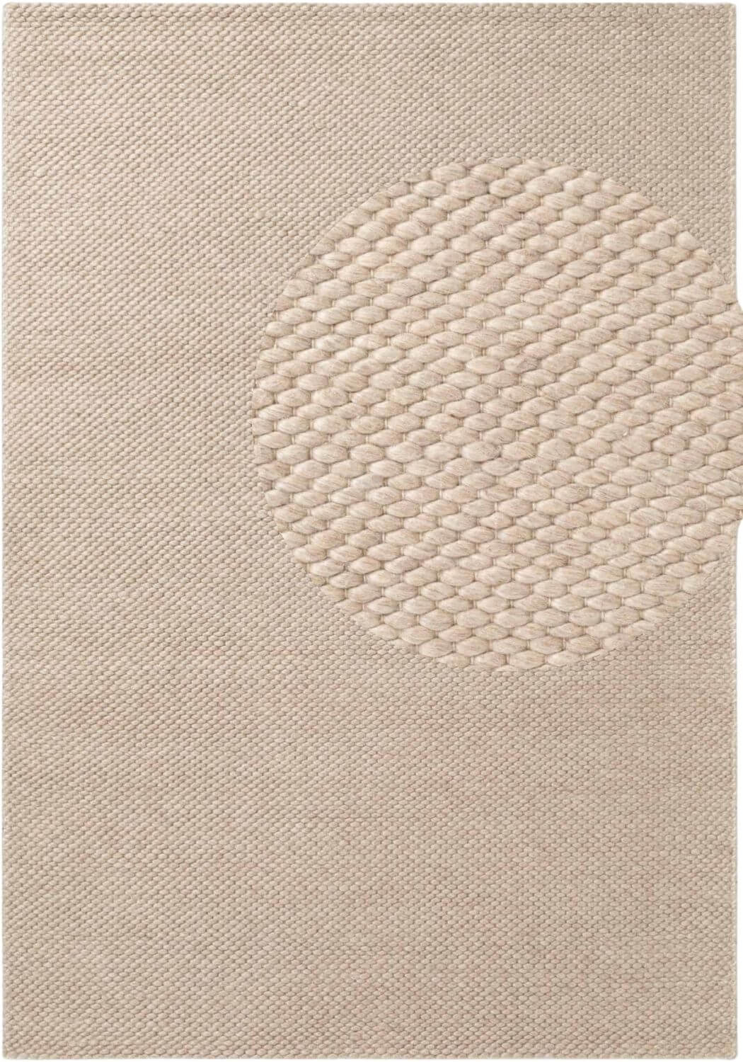 Beige textured rug with a circular pattern
