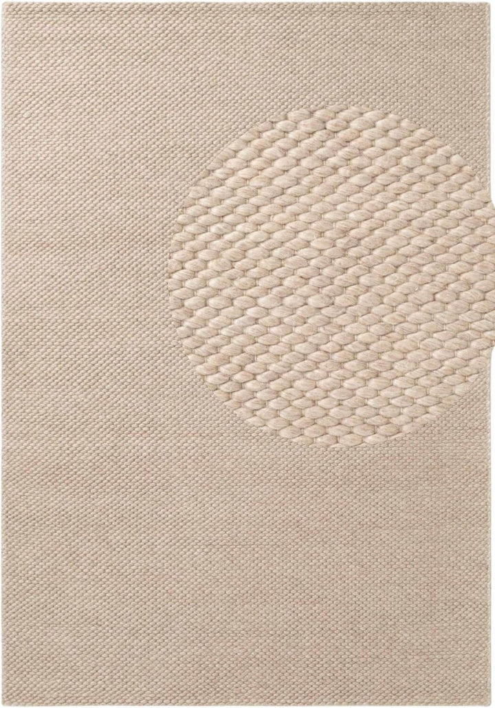 Beige textured rug with a circular pattern
