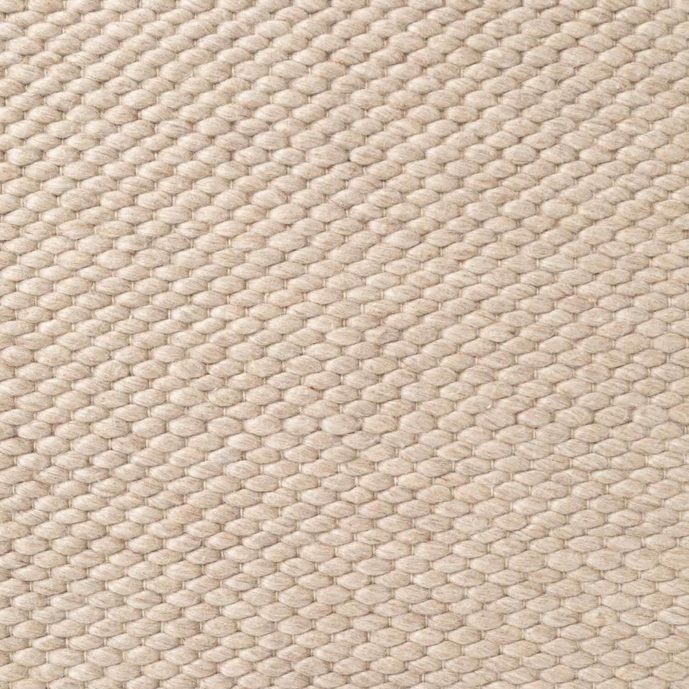 Close-up of beige woven fabric texture