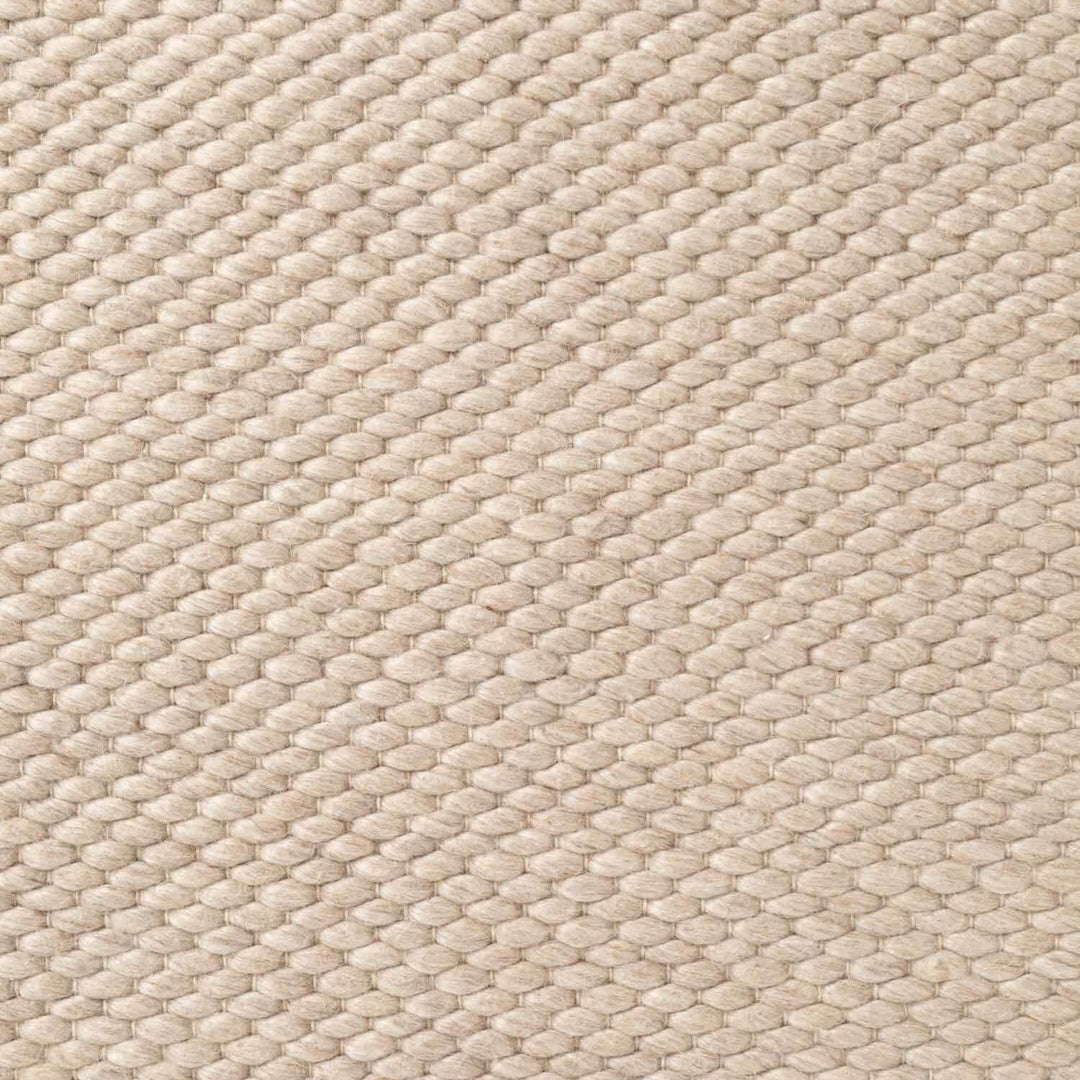 Close-up of beige woven fabric texture
