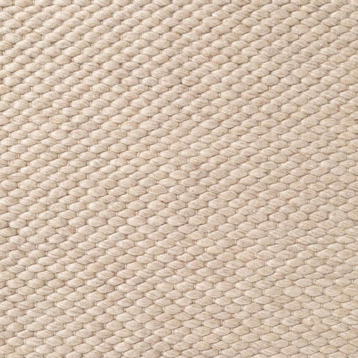 Close-up of beige woven fabric texture
