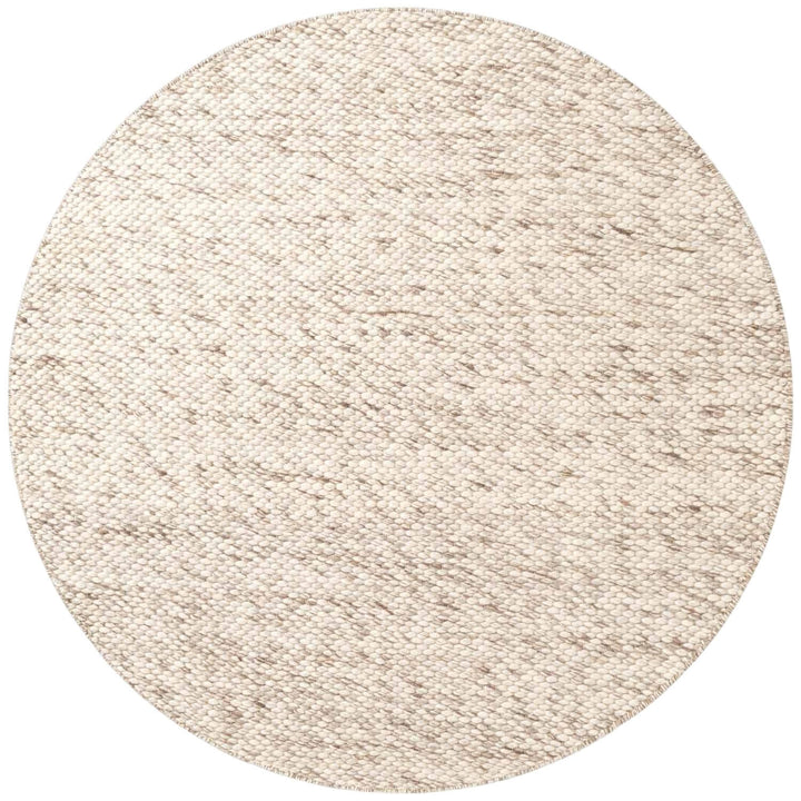 Round beige rug on a white background