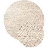 Round beige woven rug on a white background