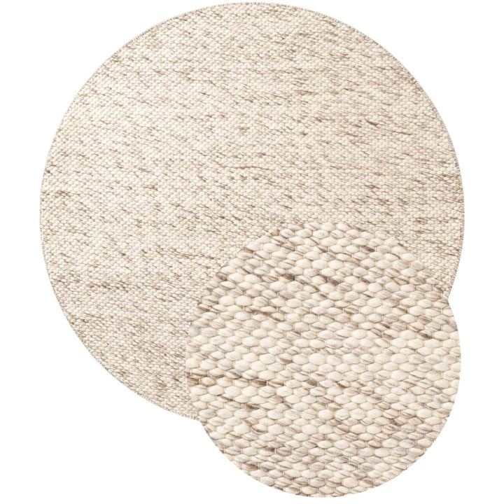 Round beige woven rug on a white background