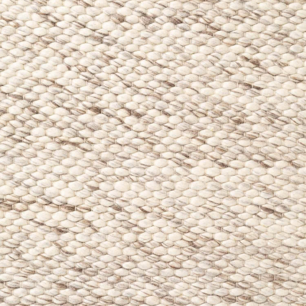 Close-up of a textured beige fabric surface