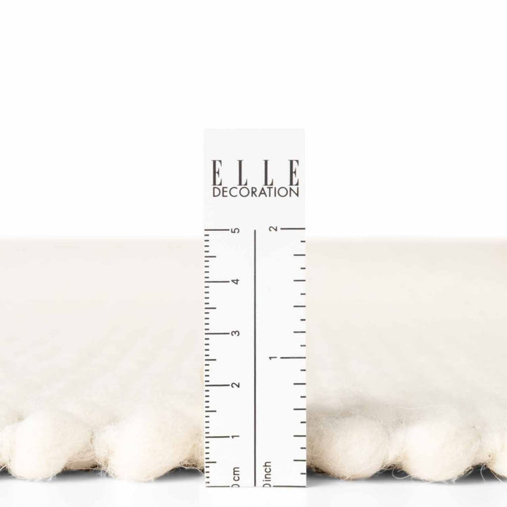 Measurement chart with ruler and 'ELLE DECORATION' branding on a white background