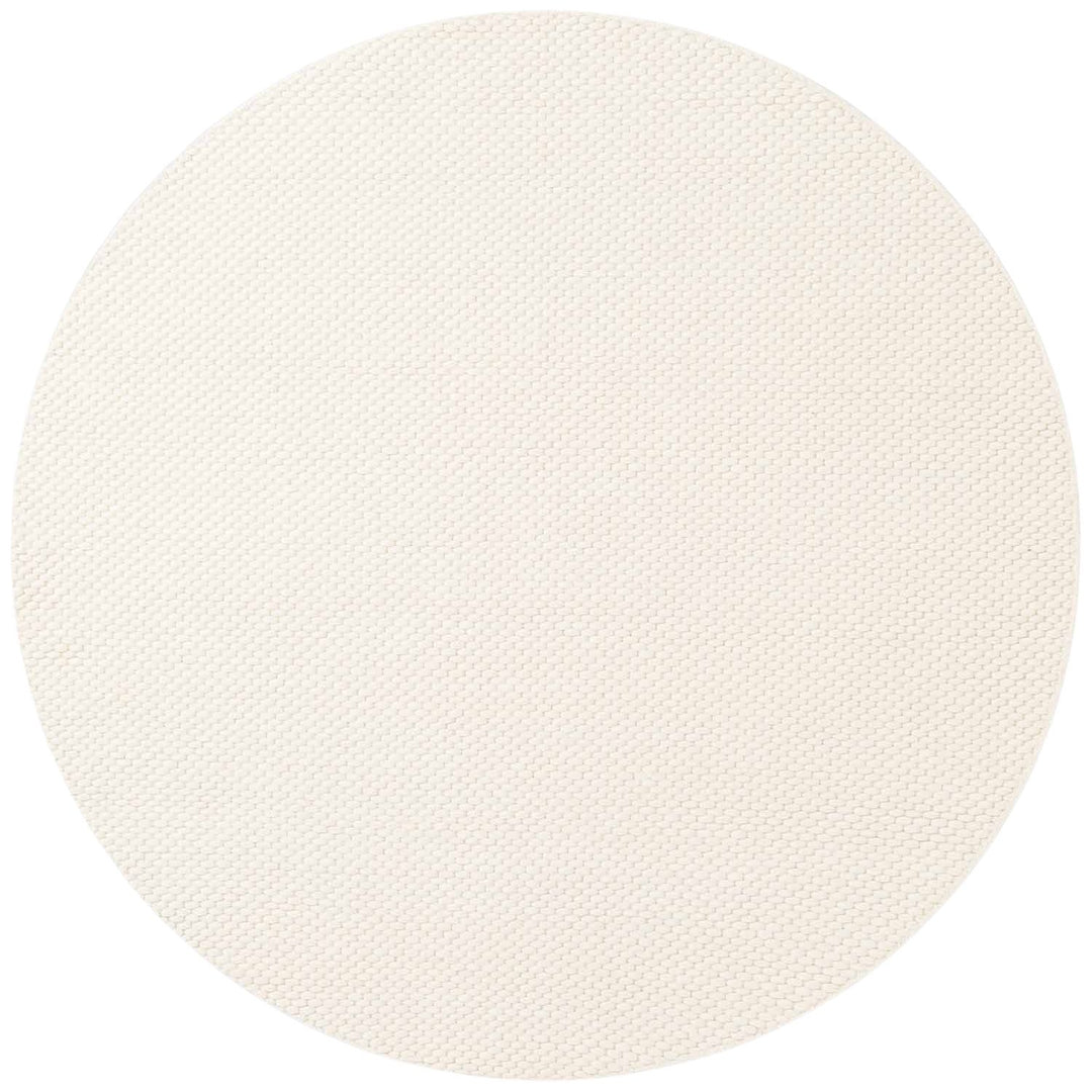 Round white rug on a white background