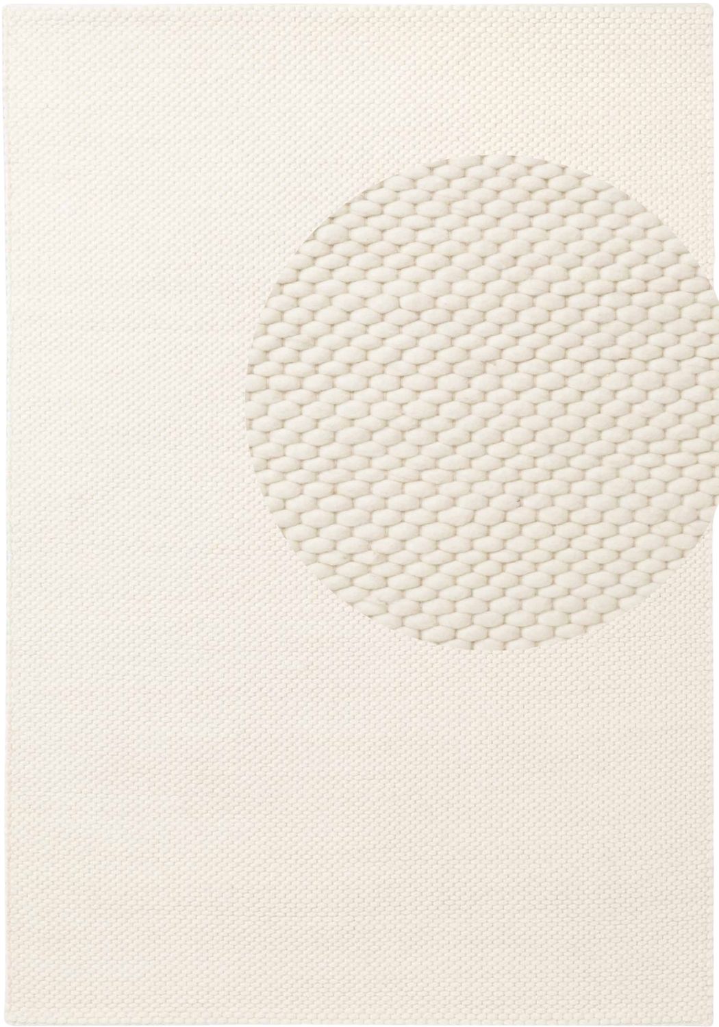 Textured white rug with geometric pattern on a plain background