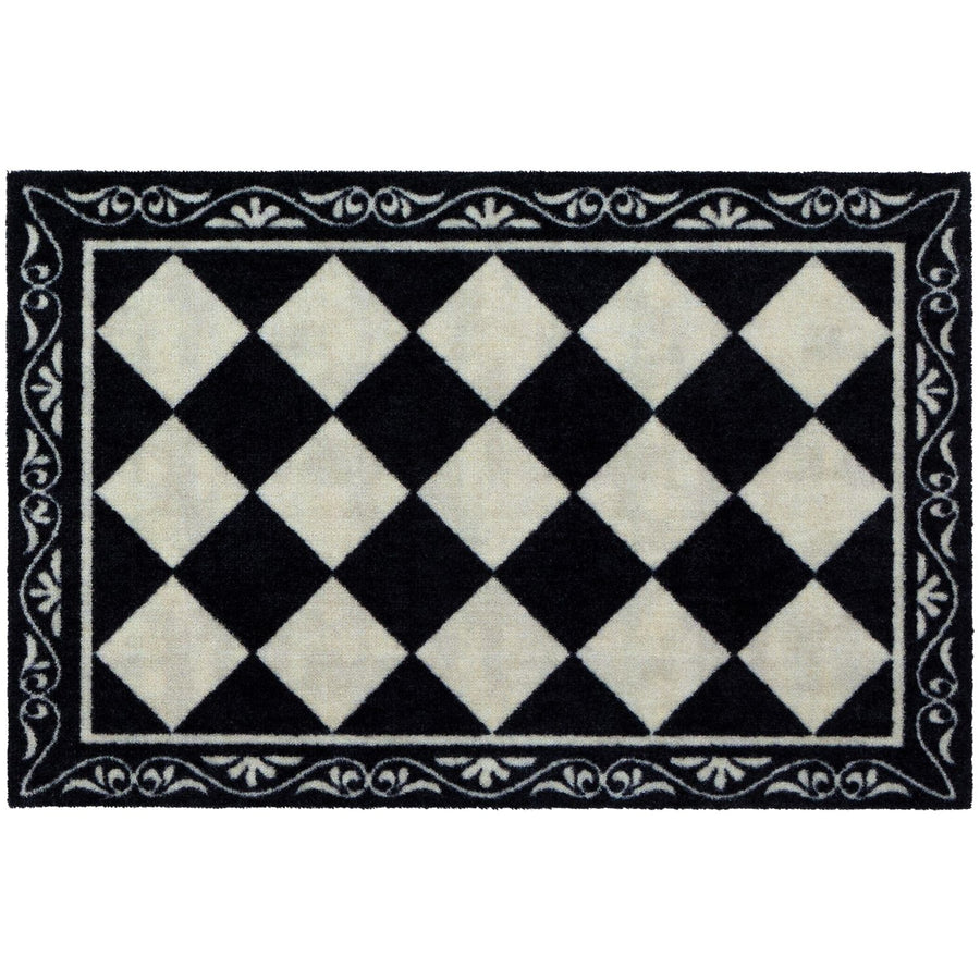 Black and white checkered rug with decorative border on a white background