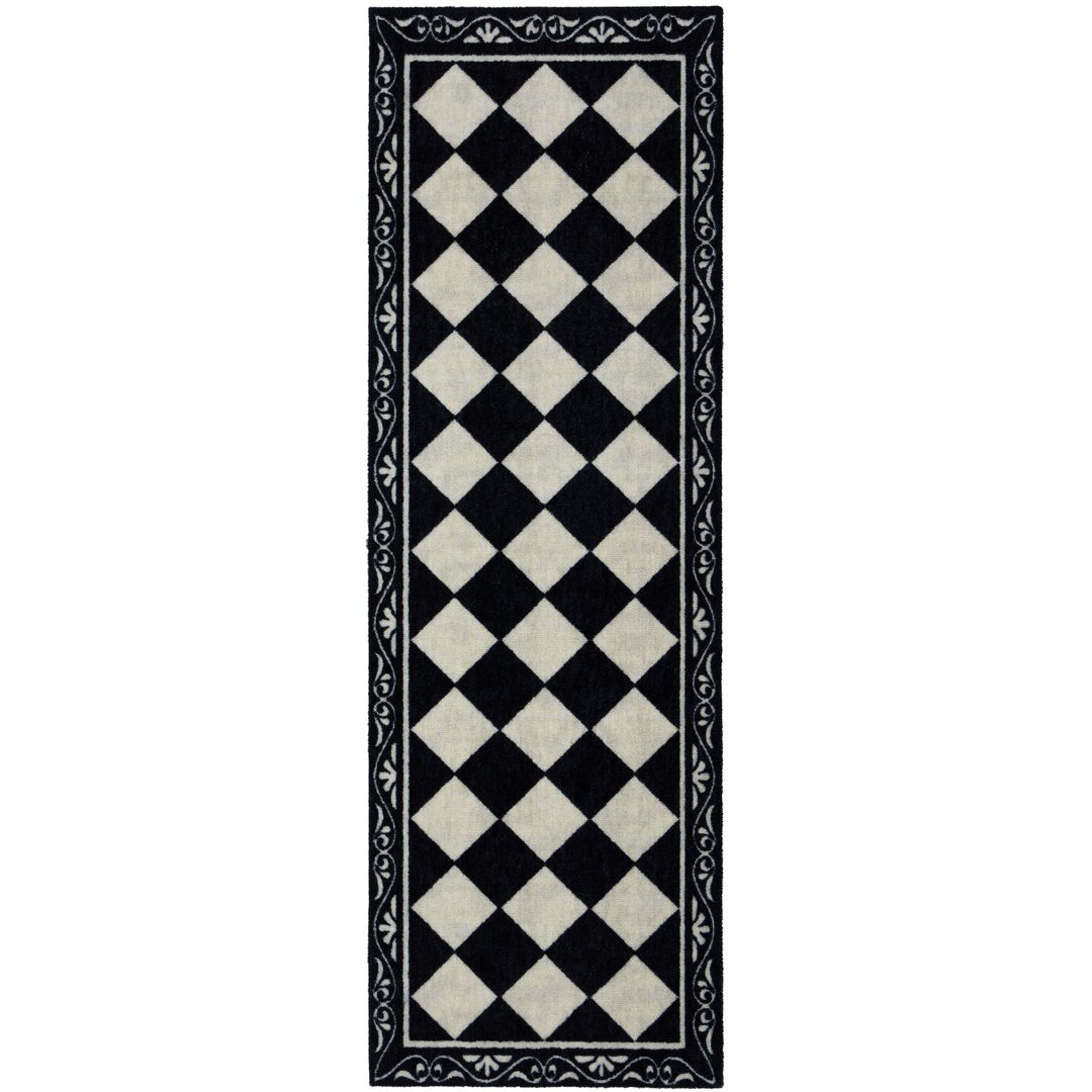 Black and white checkered rug with decorative border on a white background
